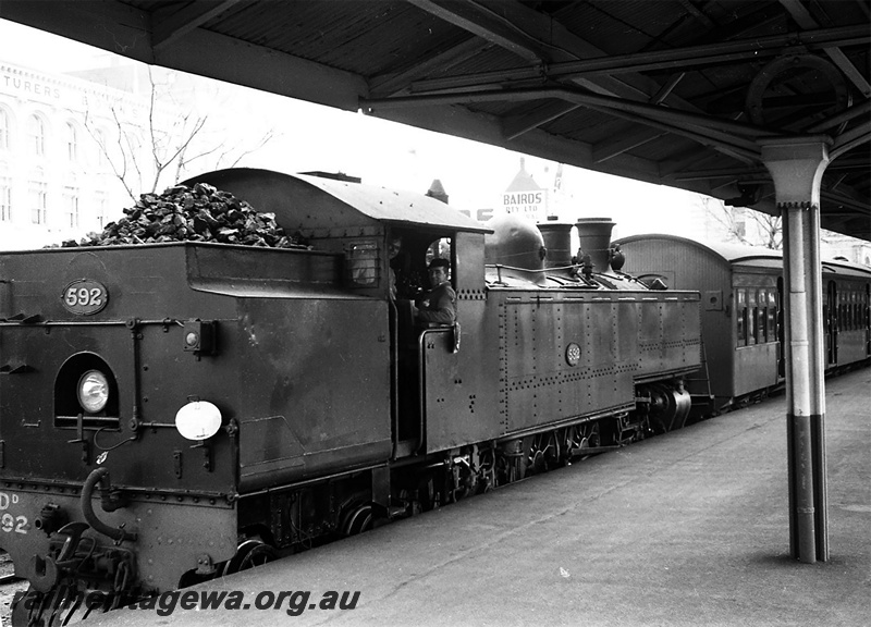 P23418
DD class 592, on passenger train, at platform, canopy, rear and side view
