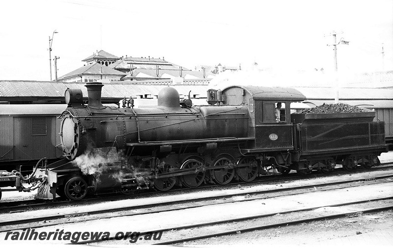 P23422
F class 412, carriage, canopy, station buildings, signal, overhead bridge railing, tracks, Perth station, ER line, front and side view
