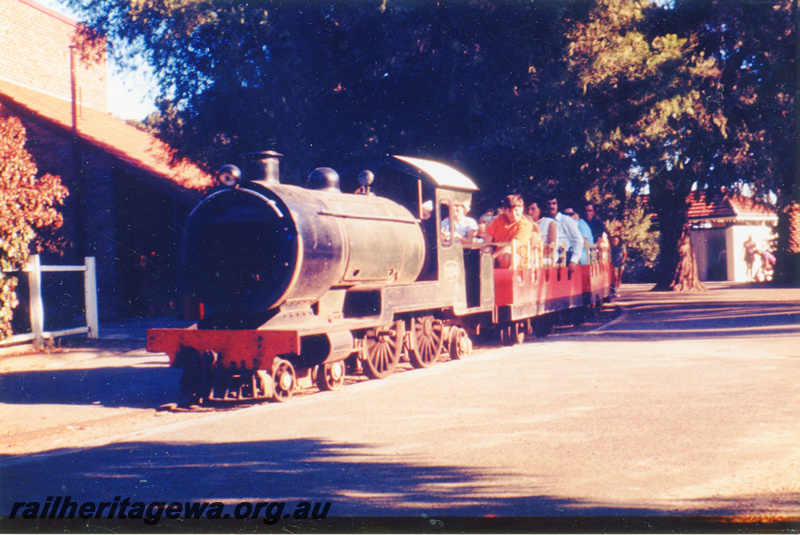 P23431
Former Perth Zoo locomotive and carriages., front and side view
