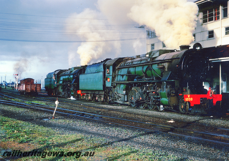 P23432
V class 1203 leads another V class light engines at Brunswick Junction station. SWR line.
