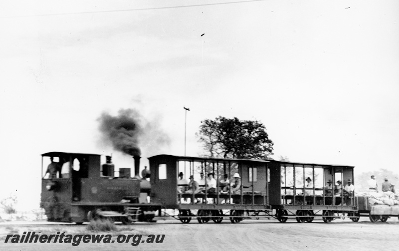 P23433
Loco Kimberley hauling 2 passenger carriages  and wagon to Broome Jetty.
