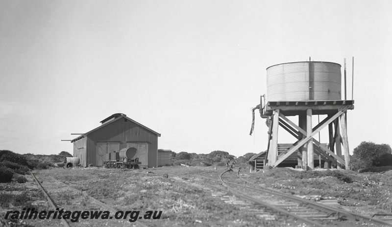 P23445
Loco  shed, water tower with a corrugated iron tank,  points, tank wagons in front of the shed, Hopetoun HR line, view from track level, c1935
