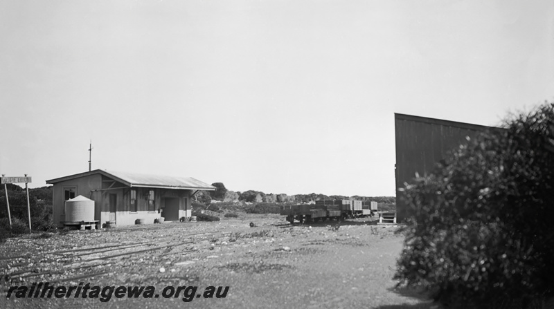 P23449
Station building, station sign, water tank, shed, wagons, track, Hopetoun, HR line, trackside view
