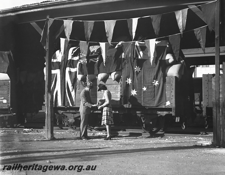 P23462
Presentation, flagged truck of chaff, sold in aid of Railway Queen, at Perth Goods shed, Perth ER line, ground level view . See also P23461
