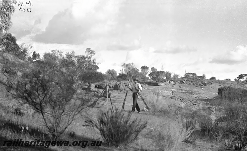 P23468
Water supply catchment, surveyor, tripods, bush, Wongan Hills EM line, ground level view
