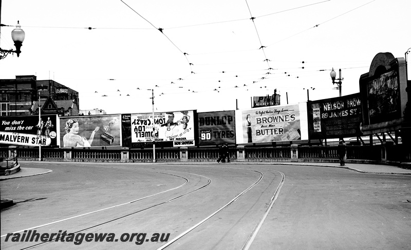 P23479
Advertising signs, tram lines, William St Horseshoe bridge, Perth, ER line, view from roadway
