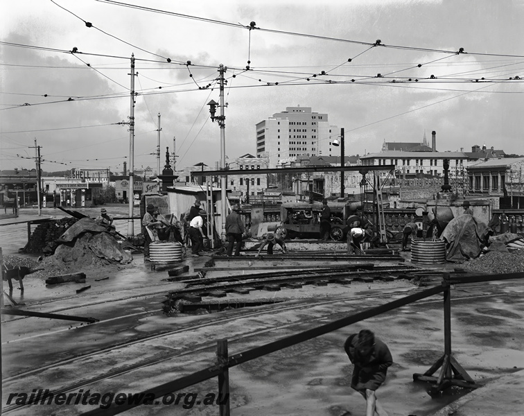 P23483
Construction work, workers, overhead tram wires, tracks, Barrack St bridge, Perth station, ER line, view from ground
