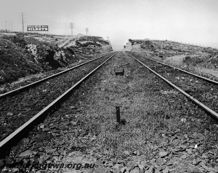 P23496
Track prior to reballasting, advertising sign, cutting, Mosman Park, ER line, track level view
