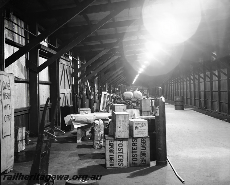 P23510
Interior view of No 4 Goods Shed, cases of Fosters lager, Perth ER line, floor level view
