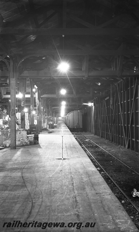 P23512
Van, platform, track, inside Perth goods shed, Perth, ER line, end view. 
