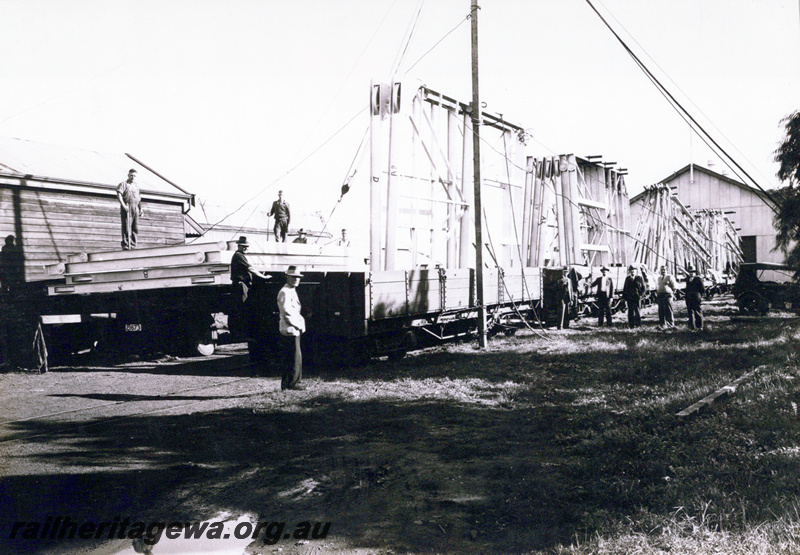 P23535
MRWA yard Midland Junction. Pre fabricated frames manufactured for the construction of a WW II RAAF hanger at Geraldton being loaded onto rail wagons. MR line.. 
