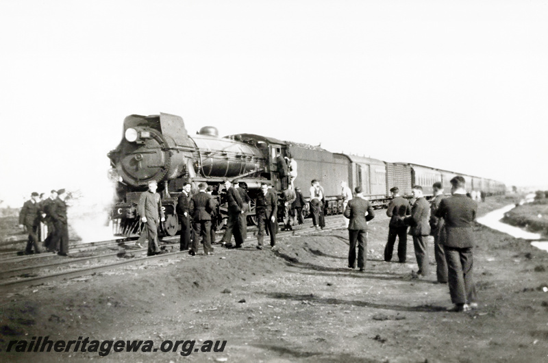 P23542
Commonwealth Railways C class 62 hauls troop train across the Nullarbor. 
