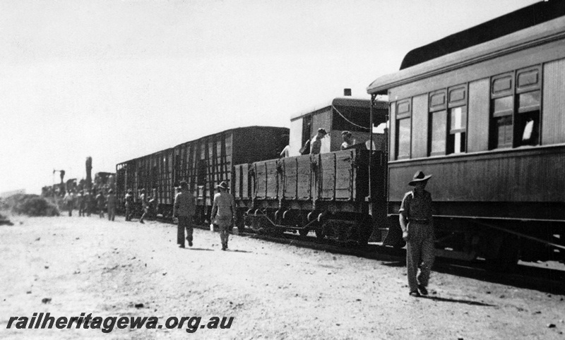 P23544
Troop train featuring a Wiles Cooker on an open wagon , cattle trucks, carriages and army equipment on flat tops on the Trans Australian Railway.
