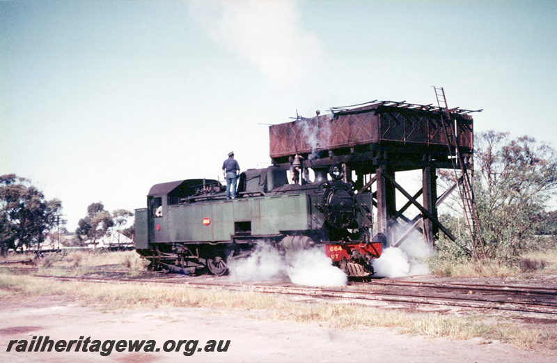 P23571
UT class 664 taking water at Watheroo. Water tank in photo. MR line.
