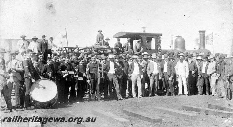 P23588
Turning of the first sod on Geraldton-Greenough Flats line, crowd of dignitaries including Governor Broome and Edward Keane, members of the Geraldton Rifles under the command of Captain Shenton, onlookers, M class steam loco, at the Two Mile, Geraldton-Greenough Flats line, ground level view 
