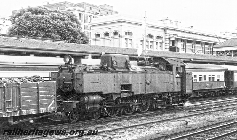 P23594
UT class 664, wagon laden with tyres, passenger carriages, canopy, station building, Perth, ER line, front and side view
