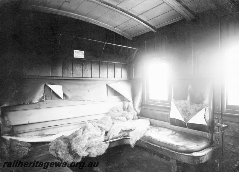 P23804
AF class carriage, compartment 133, showing seat vandalism involving cutting of upholstery and removal of stuffing, interior view
