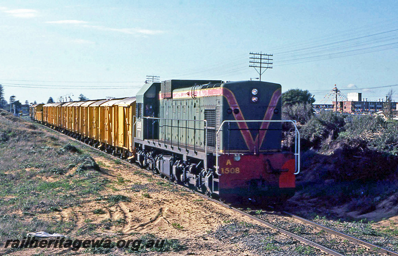 P23875
A class 1507, on goods train, loading from sidings at Bassendean and Ashfield, South Guildford, ER line, side and front view
