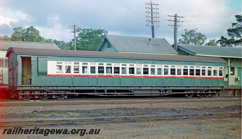 P24112
AS class 376 passenger car, platform and station buildings partly obscured, end and side view
