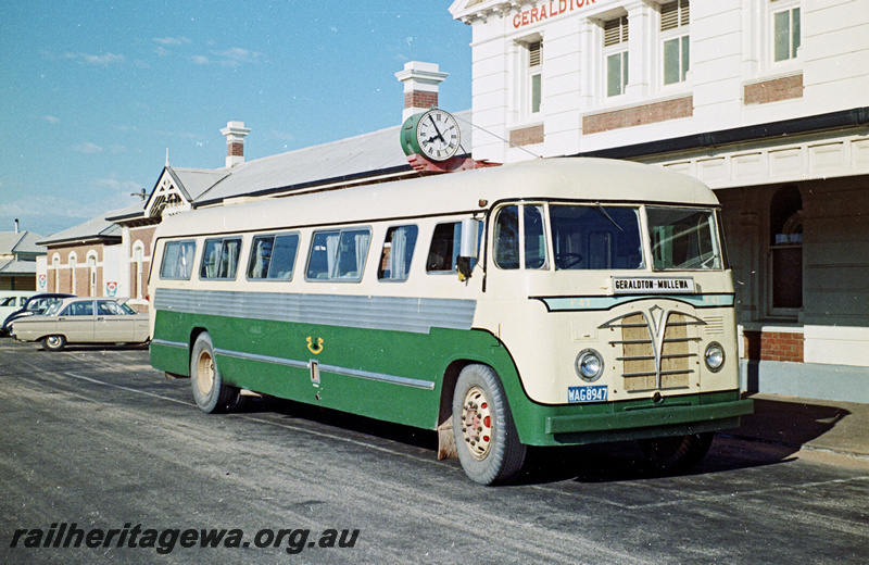 P24199
Railway Road Service  bus F47 WAG8947, on Geraldton to Mullewa route, clock showing 7.55, station buildings, bus terminal, Geraldton, NR line, side and front view
