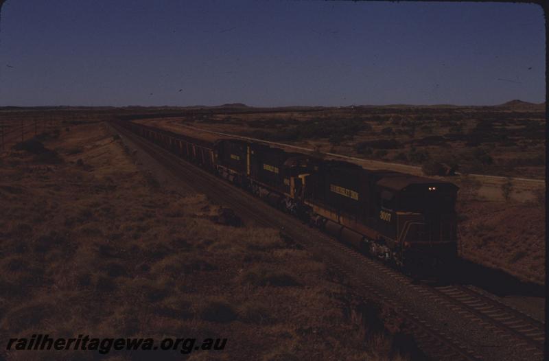 T01644
Hamersley Iron locos, C636 class 3007 leading, on iron ore train 
