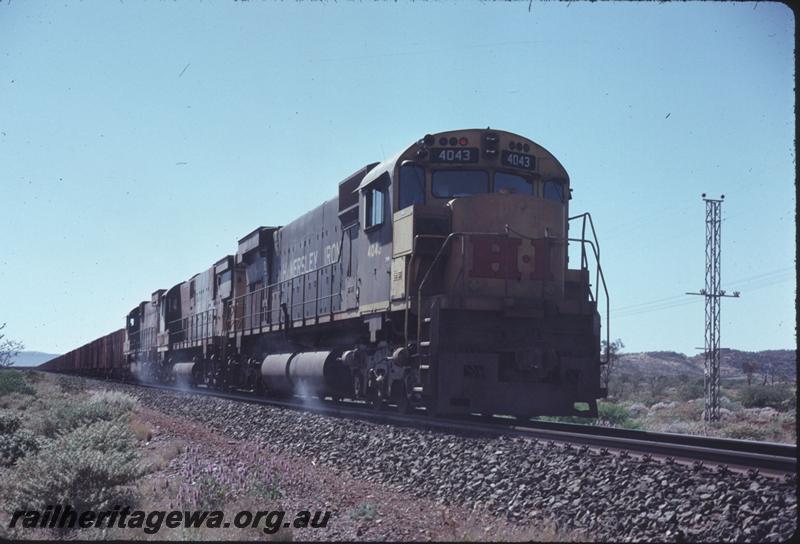 T02906
Hamersley Iron Alco locomotives M636 class 4043, C628 class 2001 and M636 class 4053 on loaded iron ore train.
