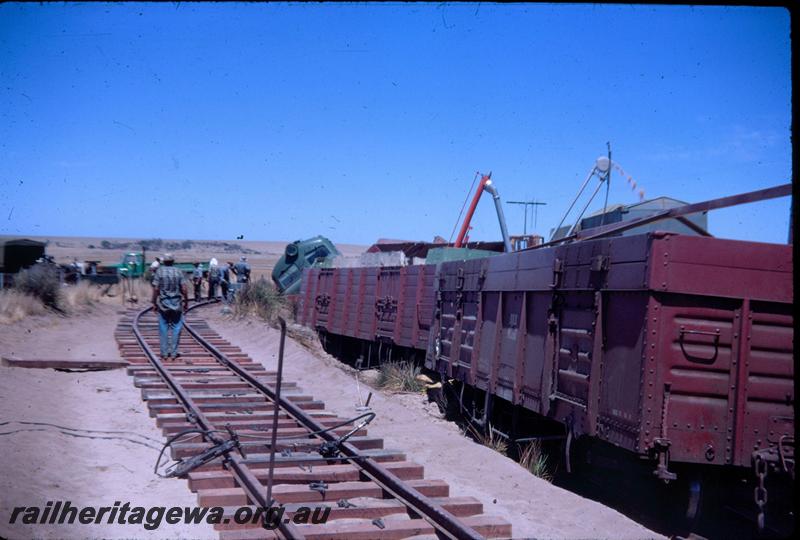 T02964
Three of ten photos of a derailment at Dongara, MR line, derailed wagons surrounded by spilt wheat
