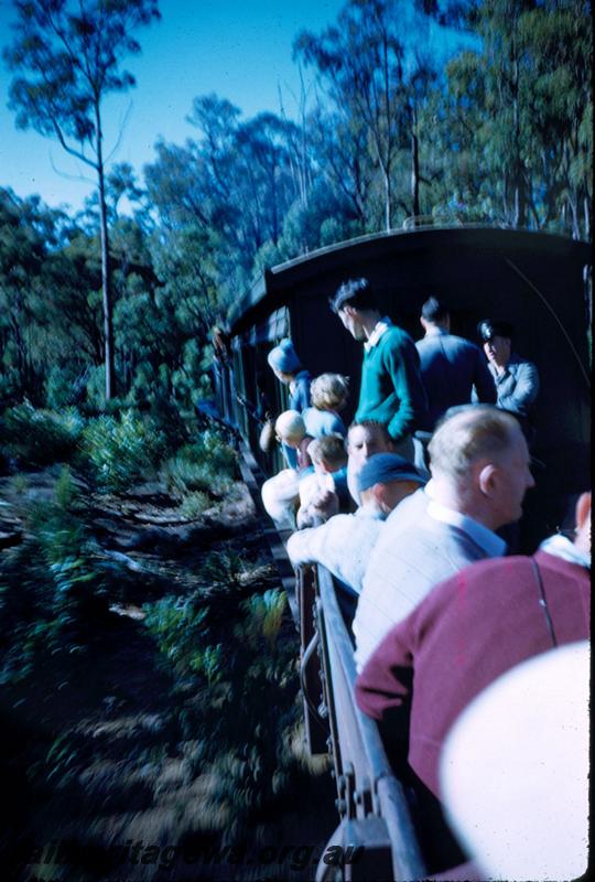 T02997
Passengers in open wagons on Millars train
