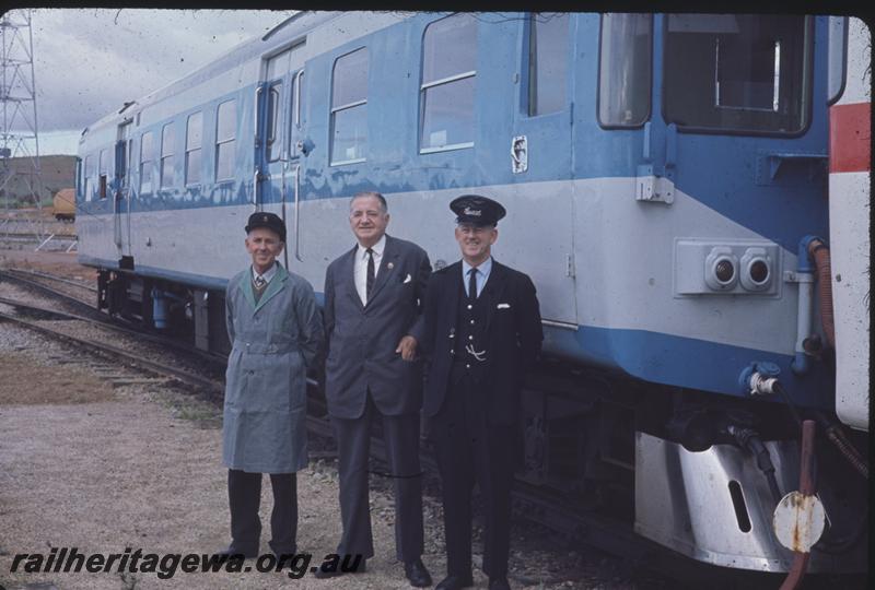 T04301
ADX class 670 in the experimental blue livery, Commissioner of Railways Mr. C. G. C. Wayne posing in the foreground with the train crew
