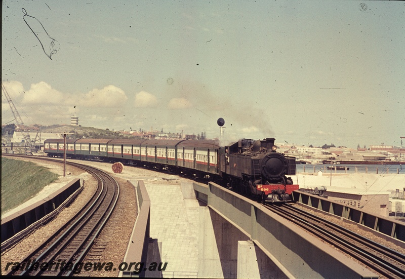 T04529
DD class 596 steam locomotive hauling a suburban set over the Fremantle Railway bridge enroute to Fremantle.
