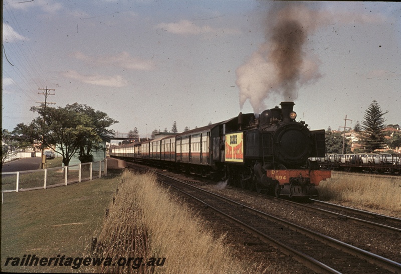 T04704
DD class 594 steam locomotive with a 'Boans Santa Special' travelling towards Perth Station at Cottesloe.
