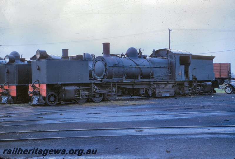 T05058
MSA class 495, another MSA class largely obscured, Bunbury loco depot, front and side view, SWR line
