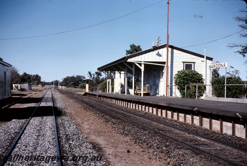 T05099
Station building, platform, baggage trolley, station signboard, signals, Waroona, SWR line, view looking south
