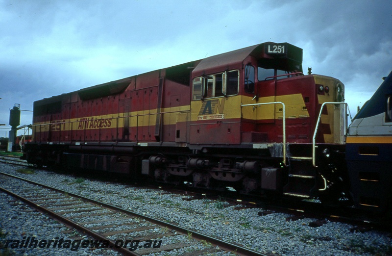 T05406
ATN Access L class 251, in red and yellow livery, Junee shed, New South Wales, side and front view
