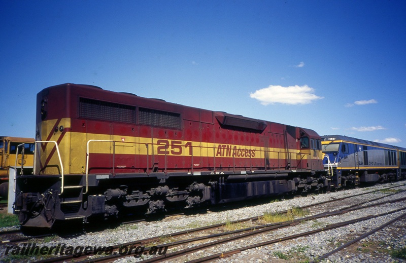 T05407
ATN Access L class 251, in red and yellow livery, Chicago Freight Car Leasing Australia  EL class 54, in blue, grey and yellow livery, Junee shed, New South Wales, end and side view
