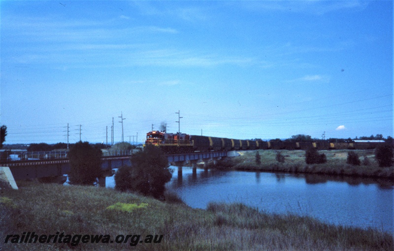 T05427
Australian Railroad Group T class 01, T class 02, double heading goods train, crossing concrete and steel bridge, Bunbury, SWR line, front and side view, taken from Leschenault Drive
