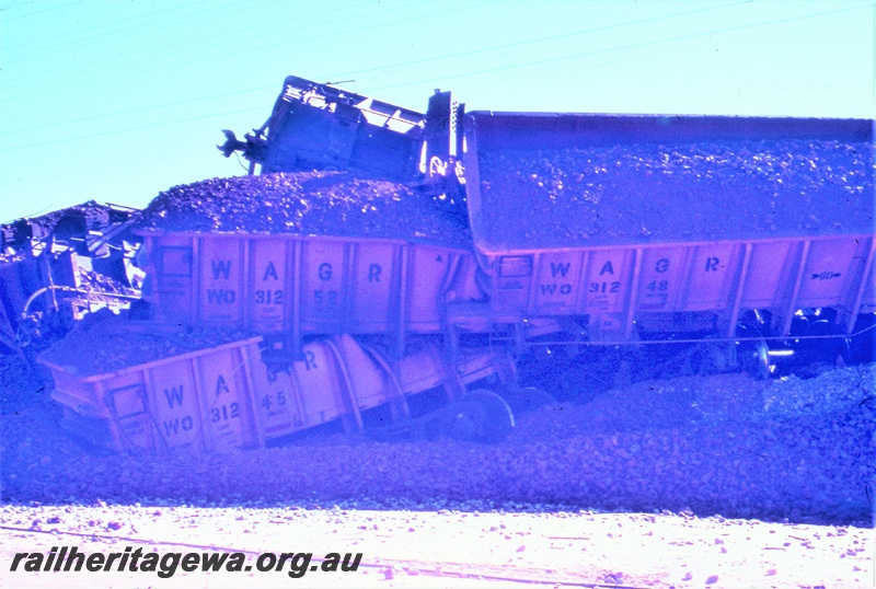 T05479
Derailment West Merredin  - 1052 loaded  iron ore train, photo depicts WO class iron ore wagons. EGR line. 
