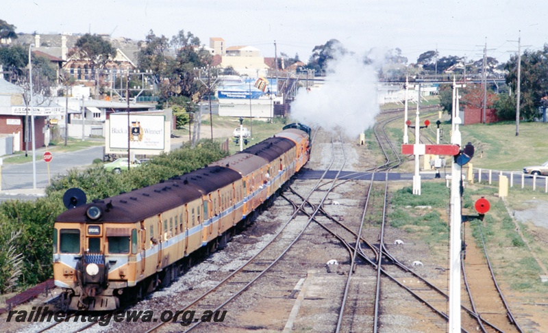 T05520
rear view of steam hauled passengers train departing Cottesloe for Fremantle. ER line.
