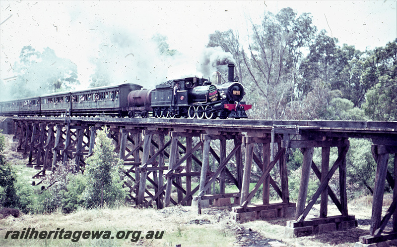 T05625
G class 112 hauling ARHS tour train from Bunbury to Wonnerup crossing Preston River at Boyanup. This trip was to unveil the first plaque to Wonnerup to mark the location where the WA Timber Company's railway crossed the WAGR line. BB line. 
