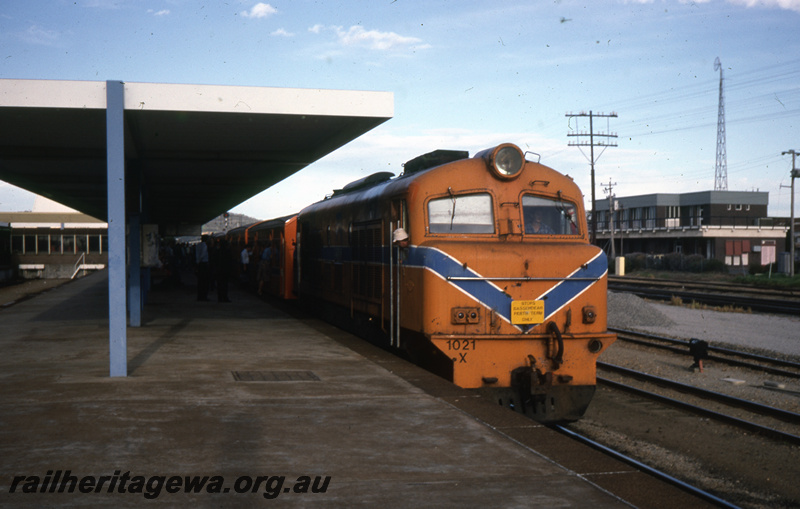 T05720
X class 1021 (orange livery) passenger train at Midland Station. ER line. 
