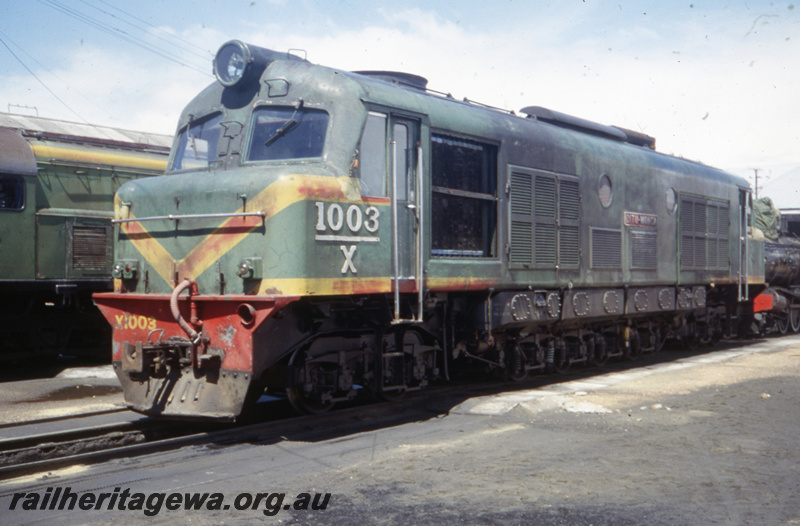 T05745
X class 1003 (green and red livery) at Bunbury loco depot. SWR line
