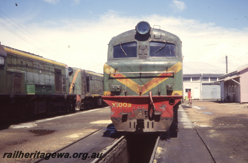 T05751
X class 1003 ( green/red livery) at Bunbury loco depot. SWR line.
