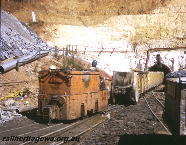 T05764
Canning Dam - dam wall extension Gemco loco with wagons showing tunnel in background. ARHS outing.
