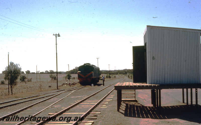 T05780
X class 1030 in the green with red and yellow stripe livery, modern Out of Shed on a raised platform, Yoting, YB line, view along the track
