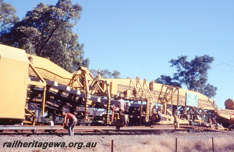 T05785
5 of 8 views of the work on the Kalgoorlie to Kwinana Rehabilitation Project featuring the P811 Track Replacement Machine. Sleepers being placed onto the roadbed
