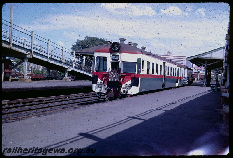 T06021
ADA Class 761 railcar trailer with an unidentified ADG Class railcar at East Perth Station, Down suburban passenger service, pram boarding service, footbridge, station nameboard, ER line
