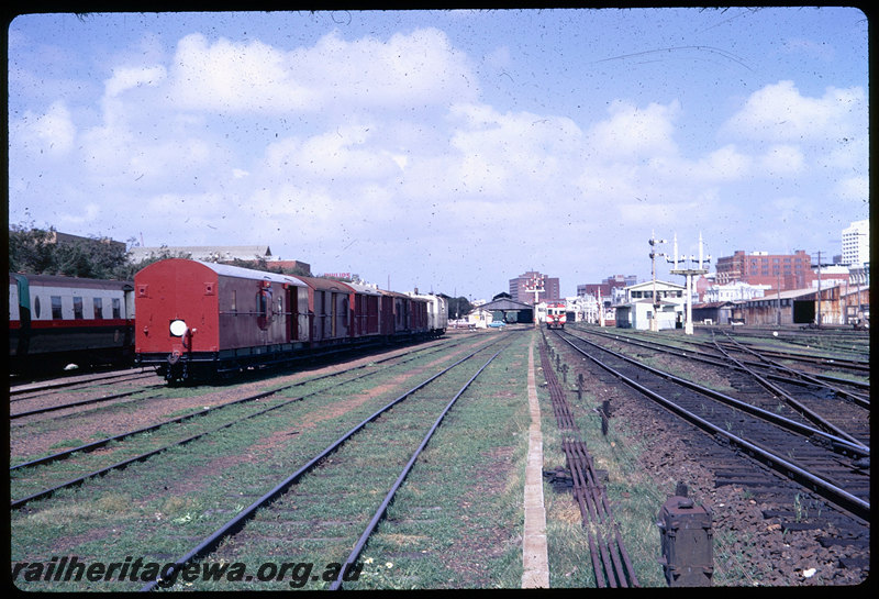 T06374
Lineup of various brakevans and wagons, Z Class 192 (ex-ZA Class 192) rebuilt with a plywood body, ADG Class railcar, Down suburban passenger service, Perth Goods Yard, goods shed, carriage shed, carriage sidings, semaphore signals, point rodding, signal wires, ER line
