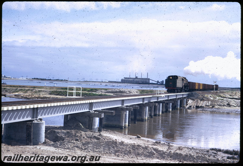 T06552
V Class 1206, empty coal train, returning from Bunbury Powerhouse, tender first, crossing Preston River Bridge, new Bunbury Inner Harbour in background
