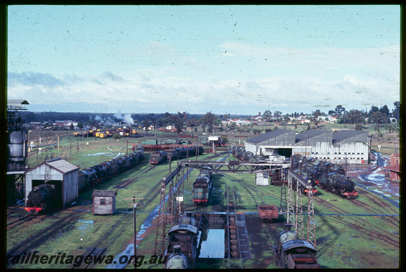 T06729
Collie loco depot, gantry crane, clamshell grab bucket, ash pit, coaling tower, roundhouse, turntable, stored steam locomotives, V Class 1220 departing Collie station with the ARHS 