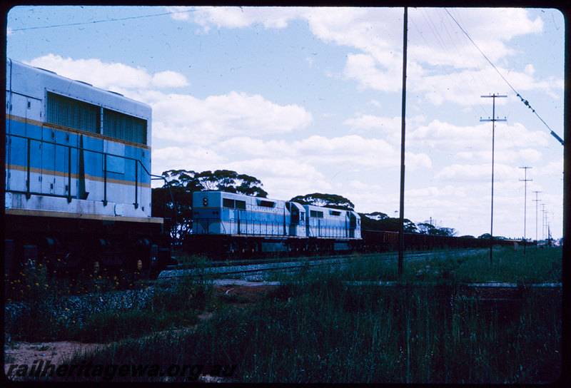 T06753
L Class 255, double heading with an unidentified L Class, Down empty iron ore train, crossing another L Class, unknown location, EGR line
